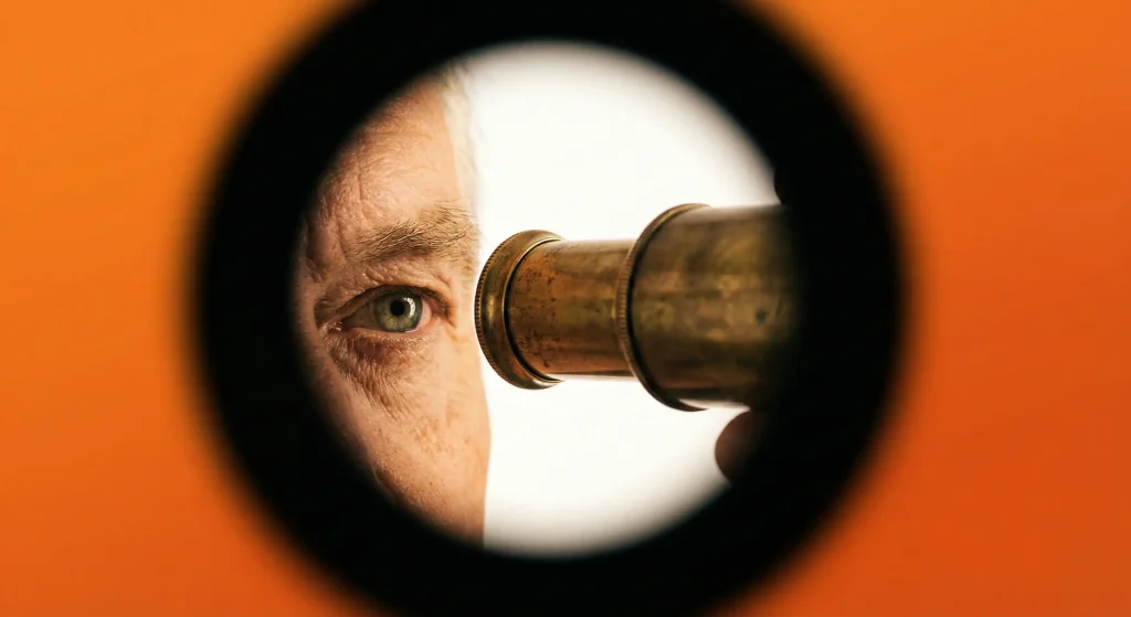 Око, що дивиться крізь оптичну трубку з затемненими краями кадру